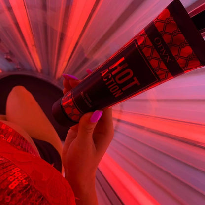 Tanned woman with Hot Action tingle sunbed tanning lotion for tanning beds